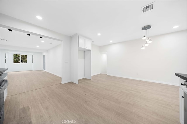 unfurnished living room featuring light hardwood / wood-style flooring