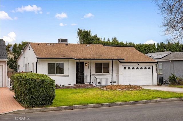 ranch-style house with a garage and a front lawn