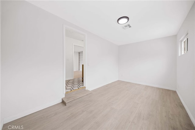 empty room with light wood-type flooring