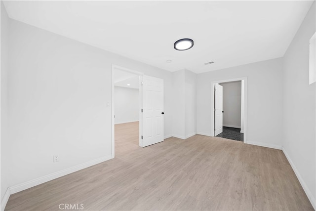 unfurnished bedroom featuring light wood-type flooring