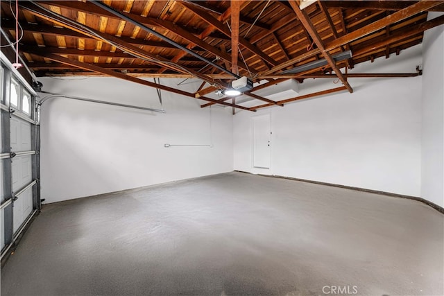 garage featuring a garage door opener and wood ceiling