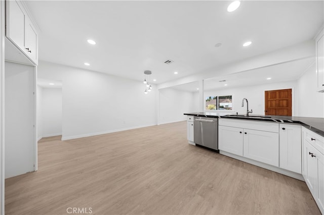 kitchen featuring white cabinetry, dishwasher, sink, and pendant lighting