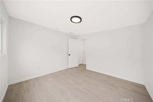 empty room with light wood-type flooring