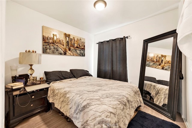 bedroom with light wood-type flooring