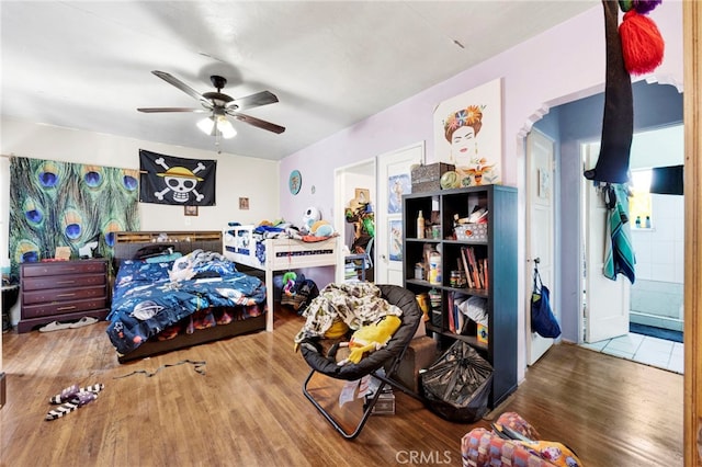 bedroom featuring hardwood / wood-style flooring and ceiling fan