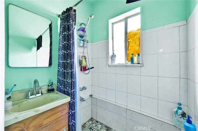 bathroom featuring vanity and a shower with curtain