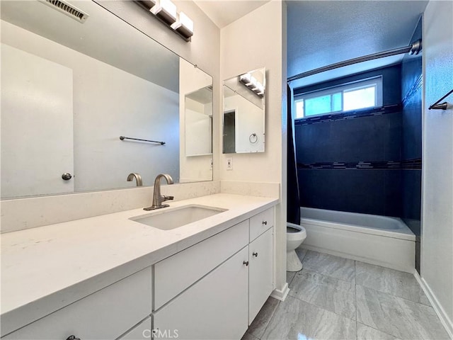 bathroom with shower / washtub combination, visible vents, vanity, and toilet