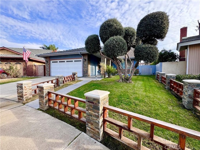 view of front of home featuring concrete driveway, fence, a front lawn, and an attached garage