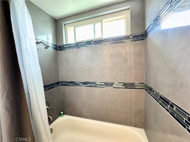 full bath with shower / bathtub combination with curtain