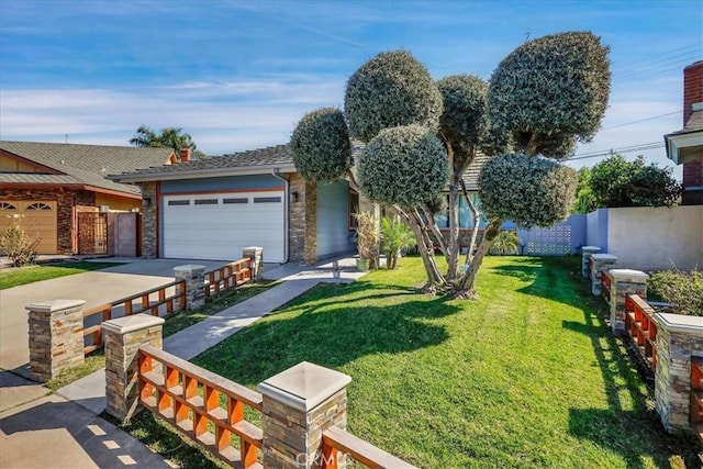 view of front of house with an attached garage, driveway, fence, and a front yard