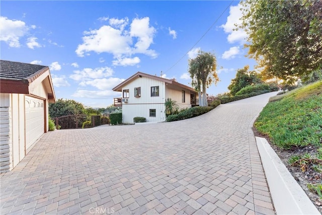 view of property exterior featuring a garage