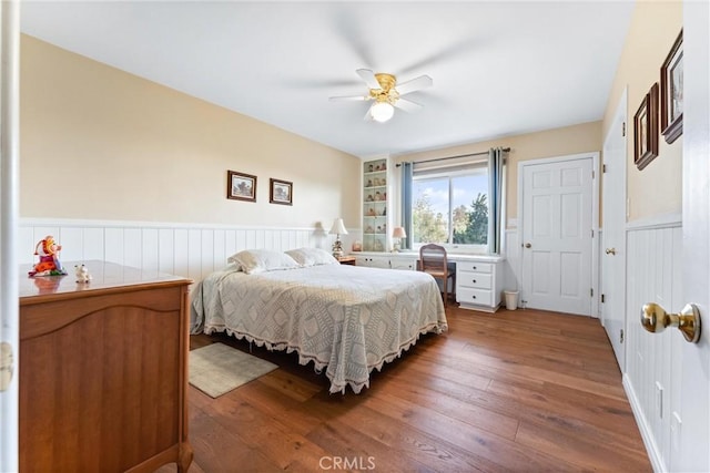 bedroom with hardwood / wood-style flooring and ceiling fan