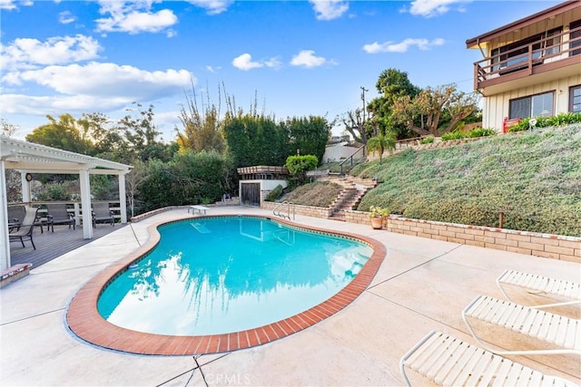 view of pool featuring a patio, a diving board, and a pergola