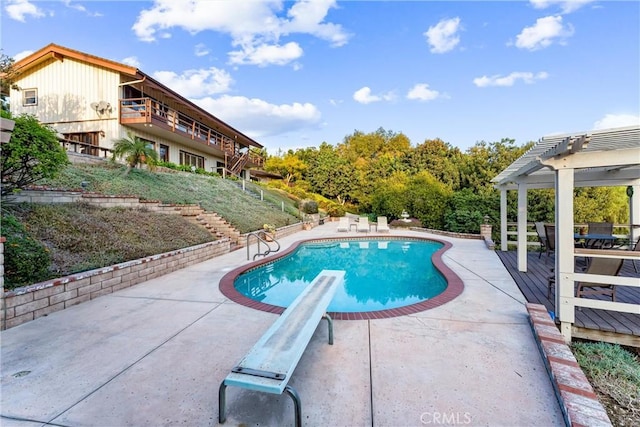 view of pool with a pergola and a patio