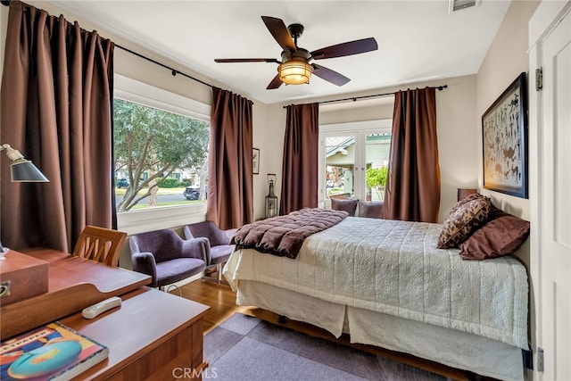 bedroom featuring hardwood / wood-style floors and ceiling fan