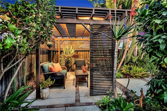 view of patio / terrace featuring a pergola and an outdoor hangout area