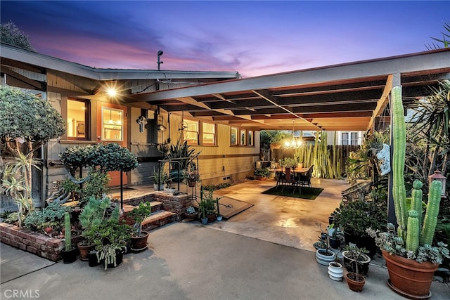 view of patio terrace at dusk