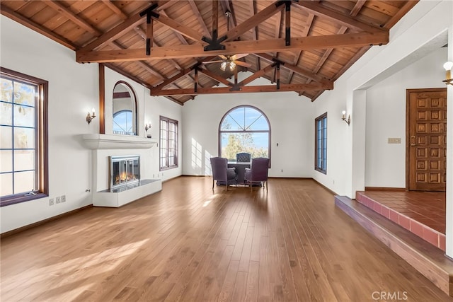 2572 Sunset Dr, Riverside, CA 92506 - unfurnished room featuring a fireplace, wooden ceiling, beamed ceiling, and wood-type flooring