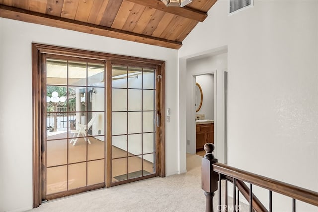 2572 Sunset Dr, Riverside, CA 92506 - entryway with wood ceiling, light carpet, and vaulted ceiling with beams
