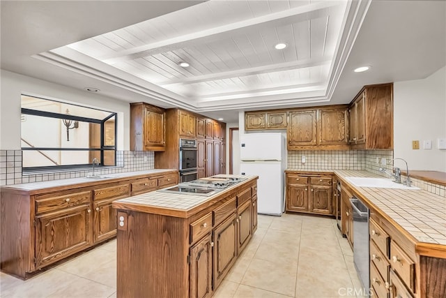 2572 Sunset Dr, Riverside, CA 92506 - kitchen with sink, tile countertops, a tray ceiling, a kitchen island, and white fridge