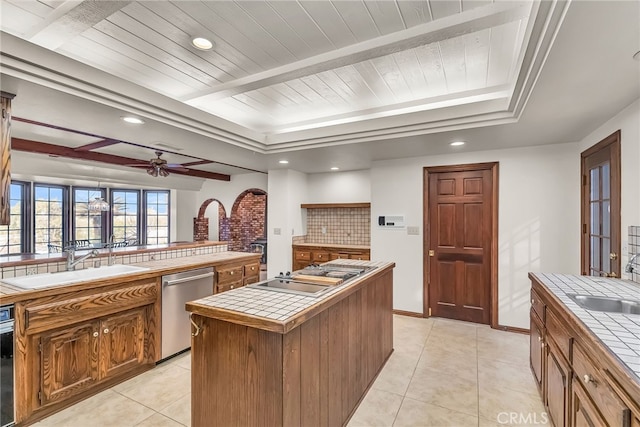2572 Sunset Dr, Riverside, CA 92506 - kitchen with dishwasher, a kitchen island, sink, and tile countertops