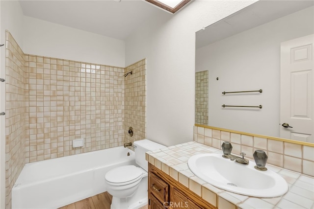 2572 Sunset Dr, Riverside, CA 92506 - full bathroom with toilet, tasteful backsplash, vanity, tiled shower / bath combo, and hardwood / wood-style floors