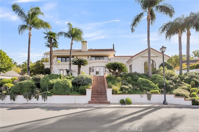 mediterranean / spanish-style house featuring a balcony