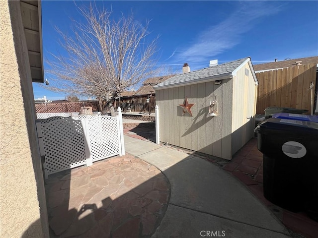 exterior space featuring a patio area and a shed