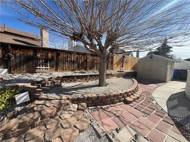 view of patio featuring a shed