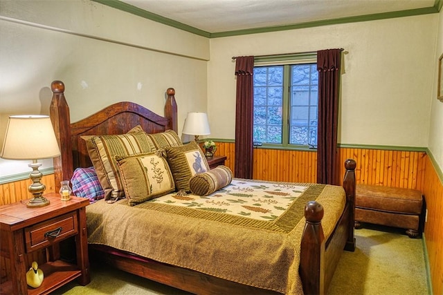 bedroom with crown molding, light carpet, and wood walls