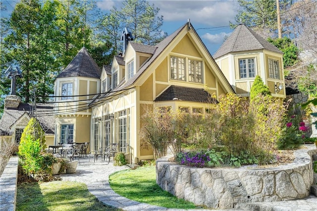 back of house with french doors and a patio