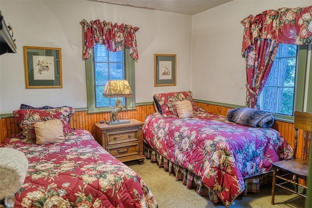 bedroom with wood walls