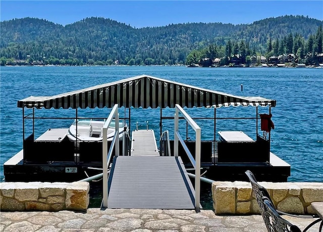 dock area with a water and mountain view