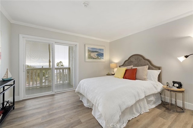 bedroom with crown molding, access to outside, and light hardwood / wood-style floors