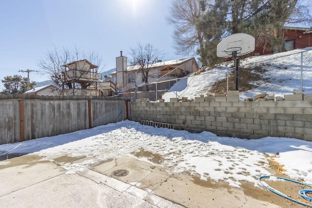 view of yard covered in snow