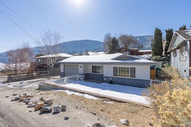 back of house with a mountain view