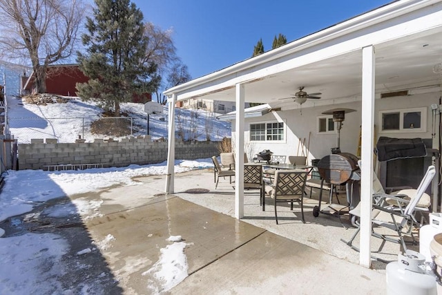 snow covered patio with ceiling fan