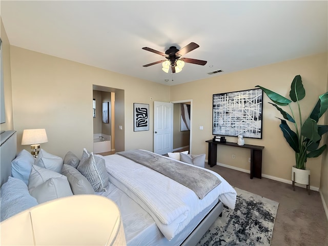 carpeted bedroom with connected bathroom and ceiling fan