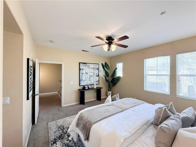 bedroom with ceiling fan and carpet