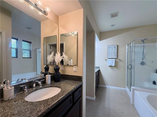 bathroom with vanity, tile patterned flooring, and separate shower and tub