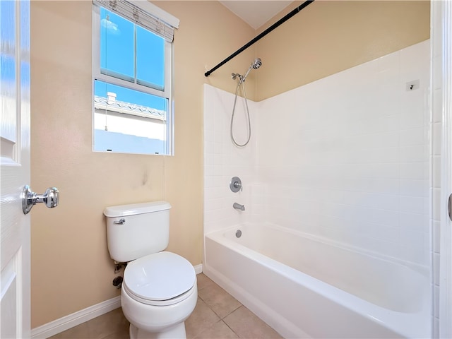 bathroom featuring tile patterned floors, bathing tub / shower combination, and toilet