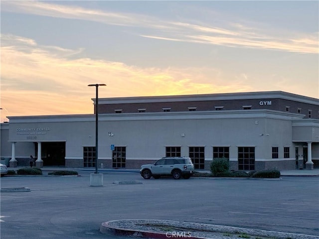 view of outdoor building at dusk