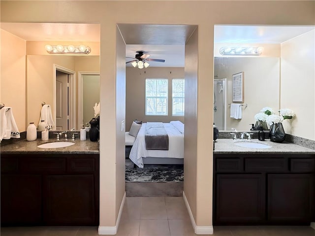 bathroom with tile patterned flooring, vanity, and ceiling fan