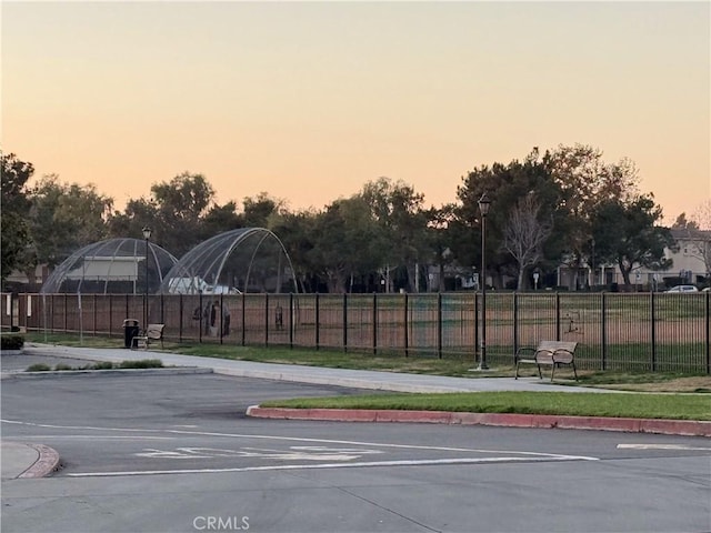 view of parking at dusk