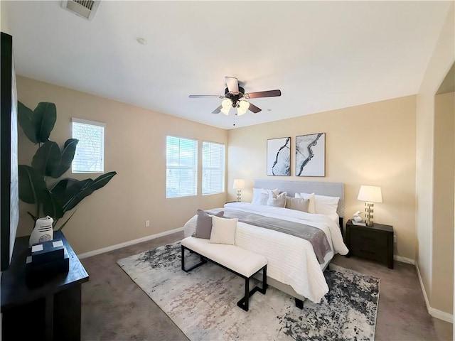 bedroom with dark colored carpet and ceiling fan