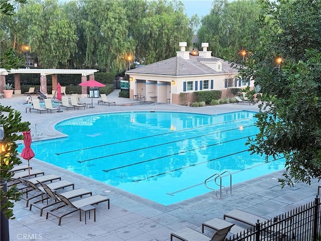 view of swimming pool featuring a patio area