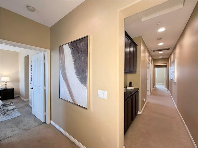 hallway with light carpet