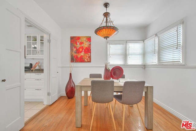 dining space with light wood-type flooring