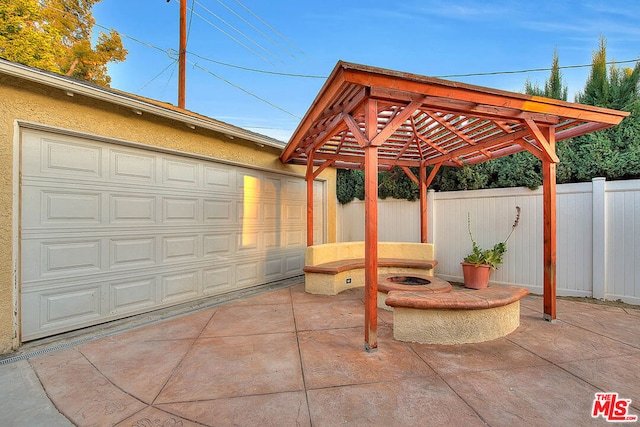 view of patio / terrace with a fire pit