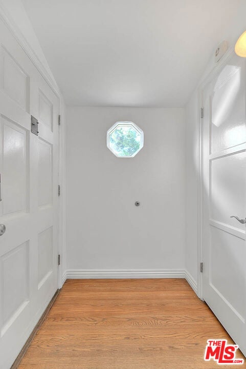 unfurnished room with light hardwood / wood-style flooring